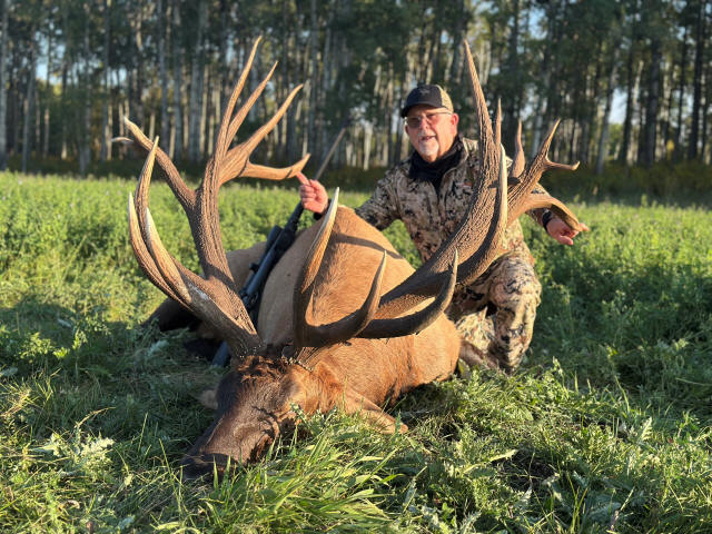 Hunter with trophy bull elk at Echo Lake Hunts