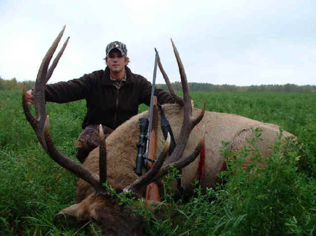 Blair Hutchins with trophy elk at Echo Lake Hunts in Saskatchewan