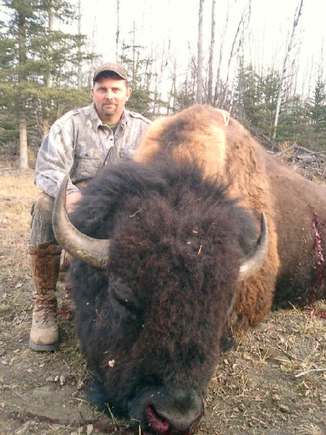 Kevin Preiss from Texas with trophy bison at Echo Lake Hunts in Saskatchewan