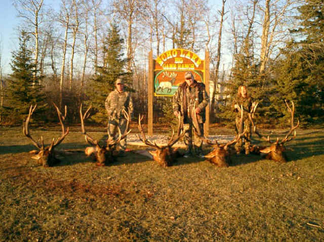 Emery, Mark & Diana with the Echo Lake Hunts sign