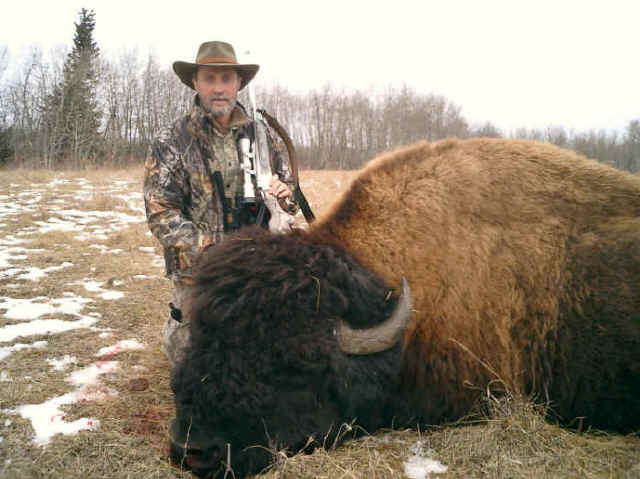 Eddie Bates from Maine with trophy bison at Echo Lake Hunts in Saskatchewan