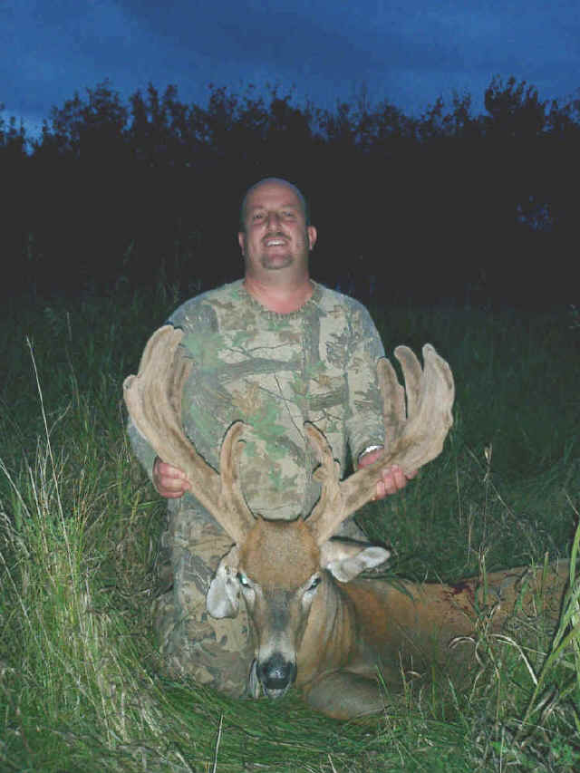 George Tunal from Texas with trophy whitetail at Echo Lake Hunts in Saskatchewan