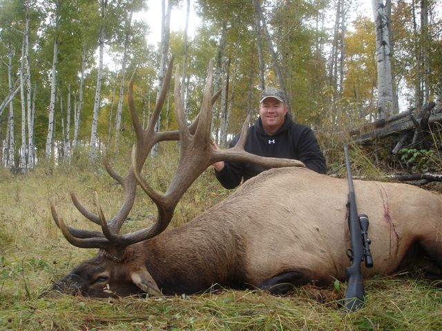 Bryce Rowley from Utah with trophy bull elk at Echo Lake Hunts in Saskatchewan