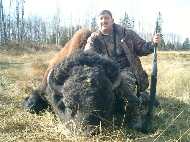 George Tunal from Texas with trophy bison at Echo Lake Hunts in Saskatchewan