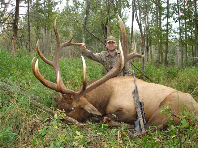 Adam Laird from Texas with trophy bull elk at Echo Lake Hunts in Saskatchewan