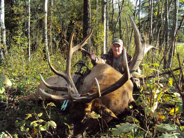 Dommie Veasuy from Florida with trophy bull elk at Echo Lake Hunts in Saskatchewan