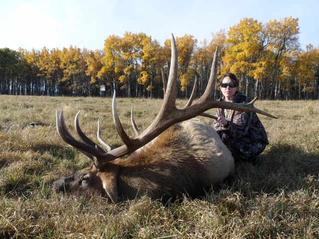 Brittany Foreman from Oklahoma with trophy bull elk at Echo Lake Hunts in Saskatchewan