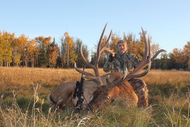 Larry Kocurek from Texas with trophy bull elk at Echo Lake Hunts in Saskatchewan