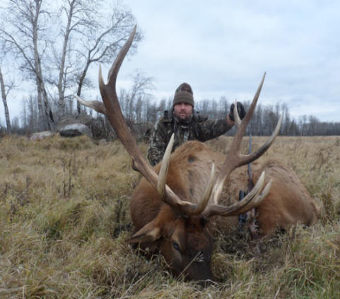 Phillip Orange from Texas with trophy bull elk at Echo Lake Hunts in Saskatchewan
