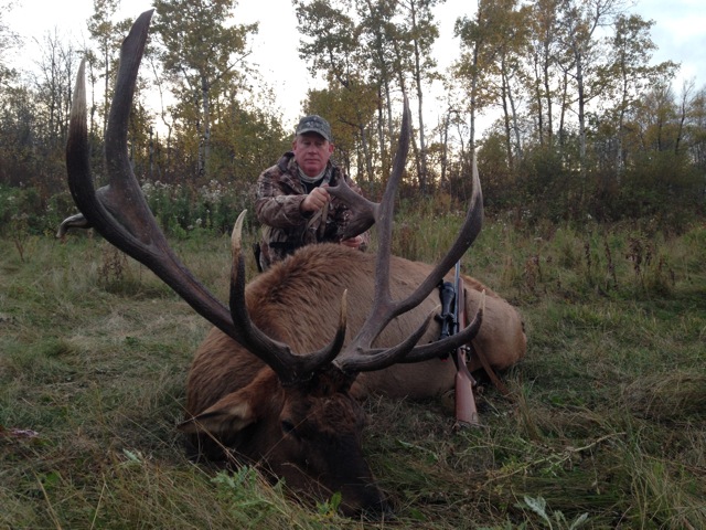 Brett Rogers from Texas with trophy bull elk at Echo Lake Hunts in Saskatchewan