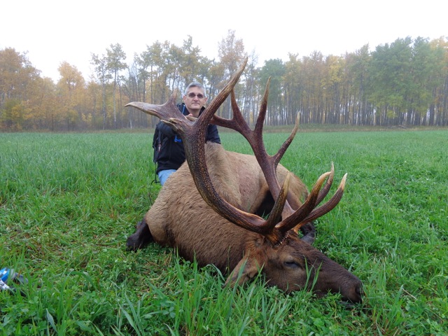 Joe Fluet II from Virginia with trophy bull elk at Echo Lake Hunts in Saskatchewan