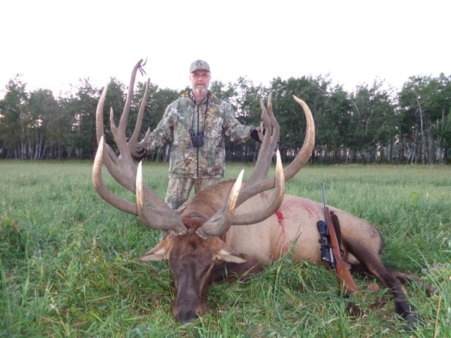 Leon Garlinghouse from New Mexico with trophy bull elk at Echo Lake Hunts in Saskatchewan