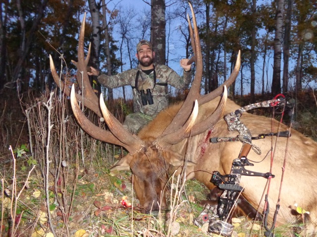 Zack Lambrechts from South Dakota with trophy bull elk at Echo Lake Hunts in Saskatchewan