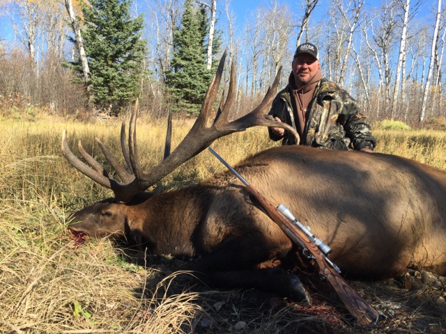 Zane Brink from South Dakota with trophy bull elk at Echo Lake Hunts in Saskatchewan
