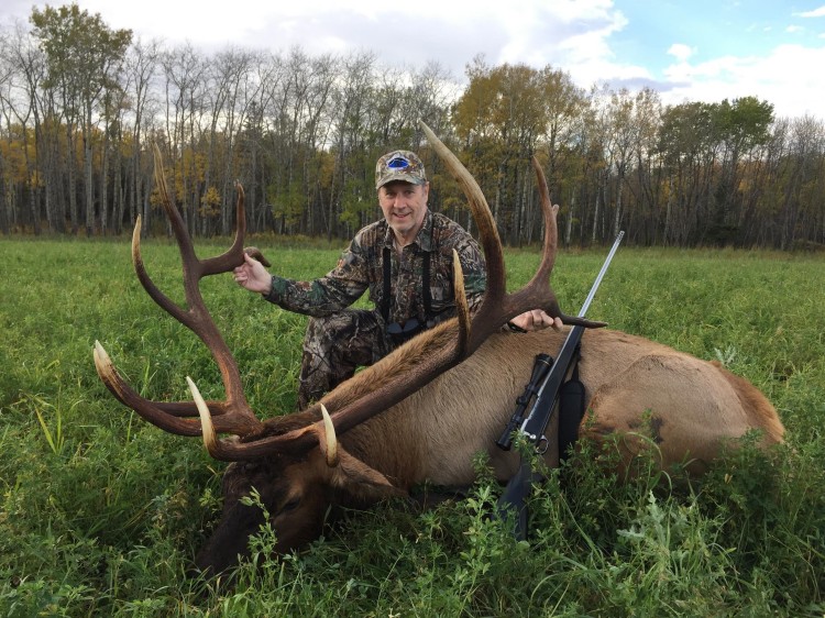 Chuck Shellhouse from Georgia with trophy bull elk at Echo Lake Hunts in Saskatchewan
