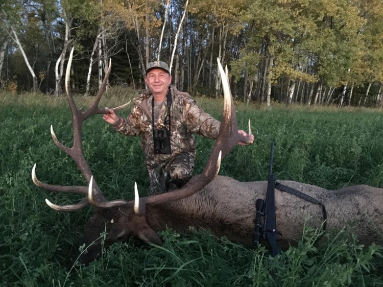 Harry from California with trophy bull elk at Echo Lake Hunts in Saskatchewan