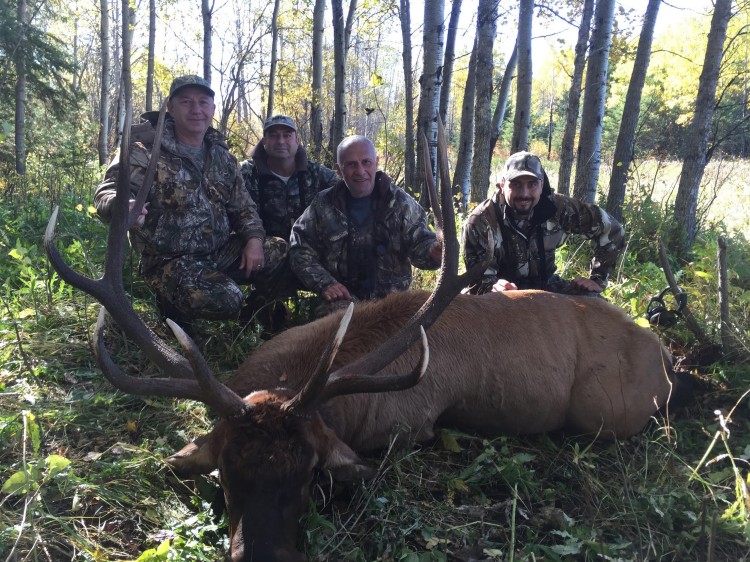 Happy hunters after hunting elk in Saskatchewan Canada