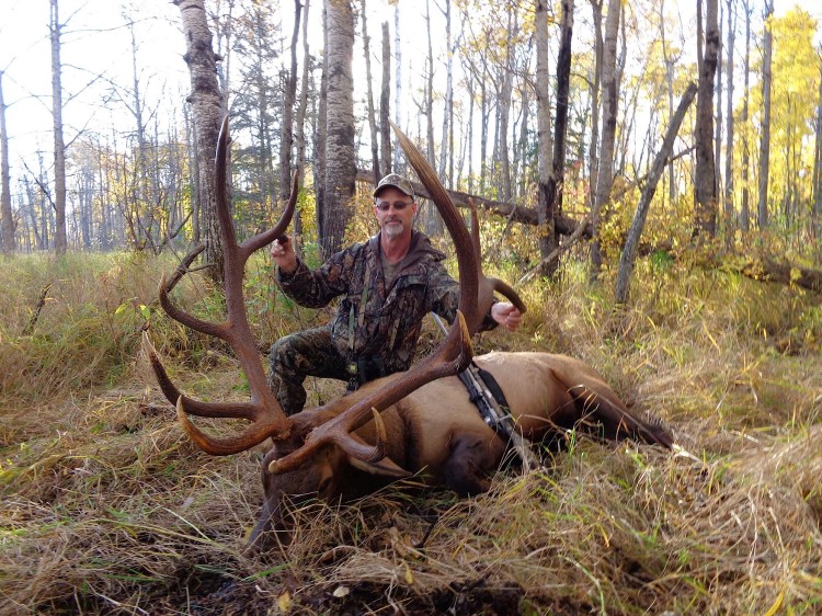 Randy King from Nebraska with trophy bull elk at Echo Lake Hunts in Saskatchewan