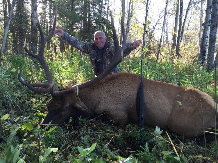 Sarkis from California with trophy bull elk at Echo Lake Hunts in Saskatchewan