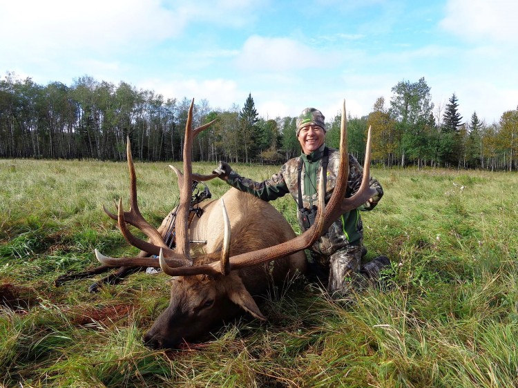 Willie Guizar from Texas with trophy bull elk at Echo Lake Hunts in Saskatchewan