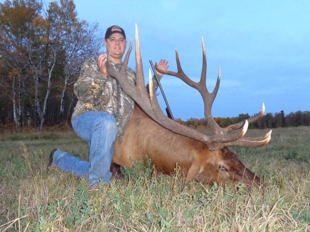 Trevor Wyman from North Dakota with trophy bull elk at Echo Lake Hunts in Saskatchewan