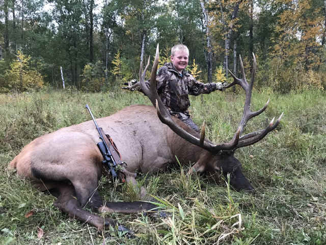 Seth Clayton from British Columbia with trophy bull elk at Echo Lake Hunts in Saskatchewan