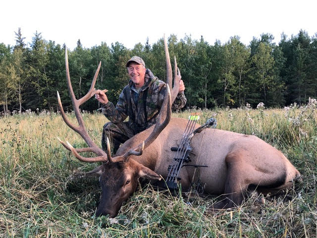 Frank McDonald from Canada with trophy bull elk at Echo Lake Hunts in Saskatchewan