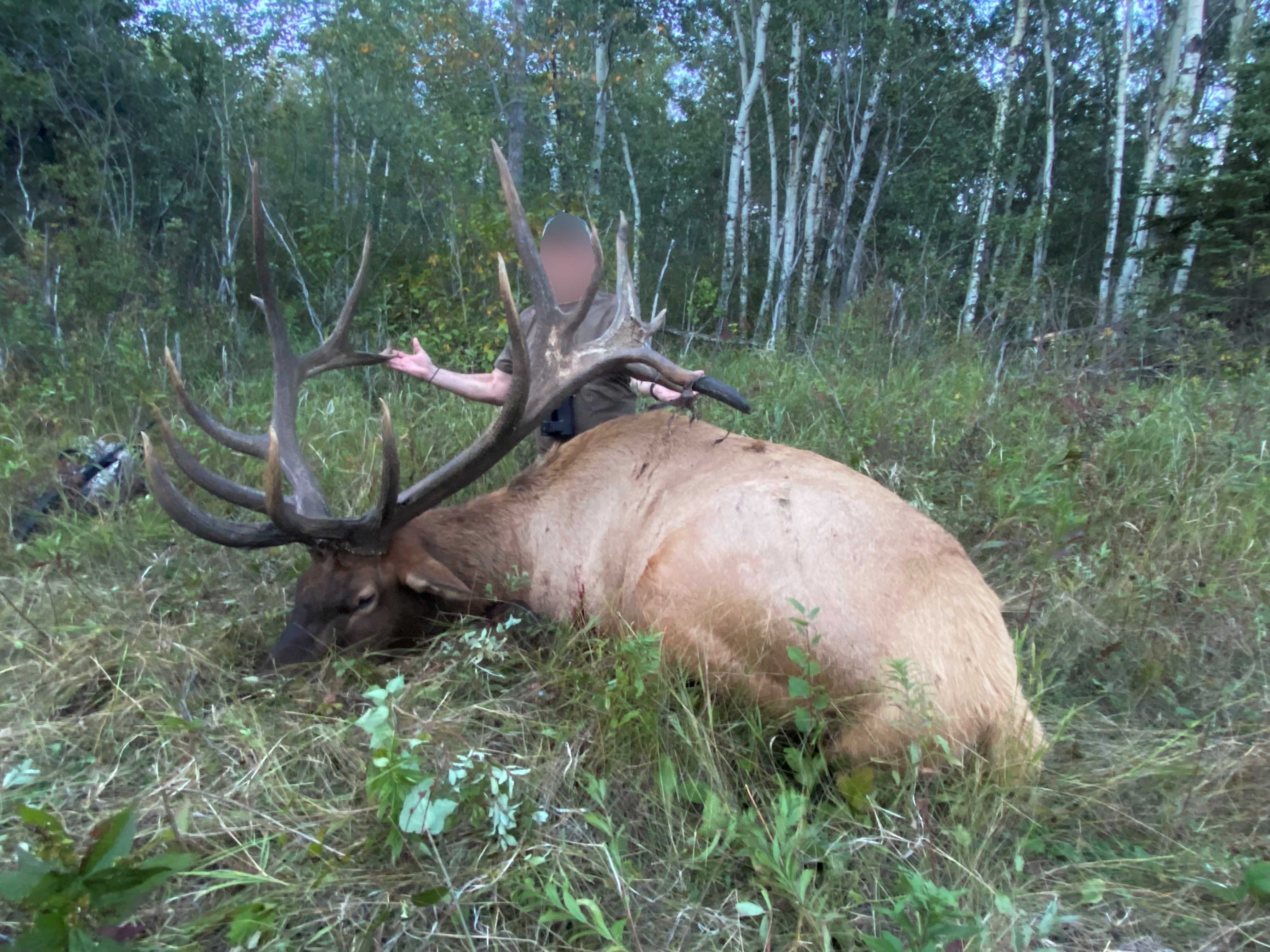 Hunter from North Dakota with trophy bull elk at Echo Lake Hunts in Saskatchewan