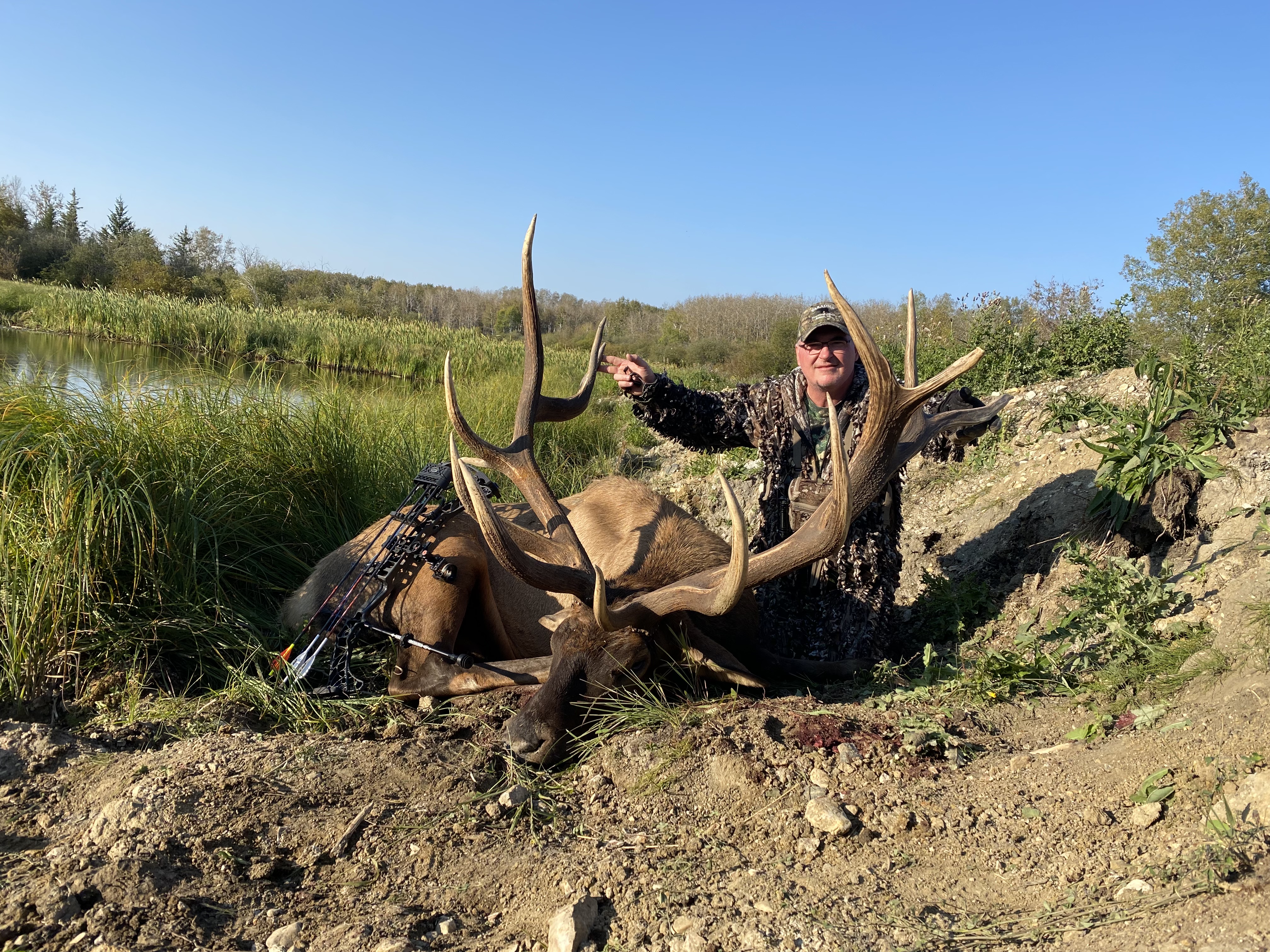 Barry Shrader from Texas with trophy bull elk at Echo Lake Hunts in Saskatchewan