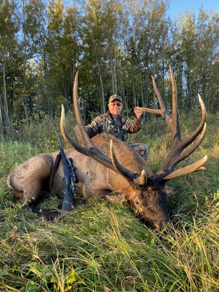 Dan Mason from California with trophy bull elk at Echo Lake Hunts in Saskatchewan