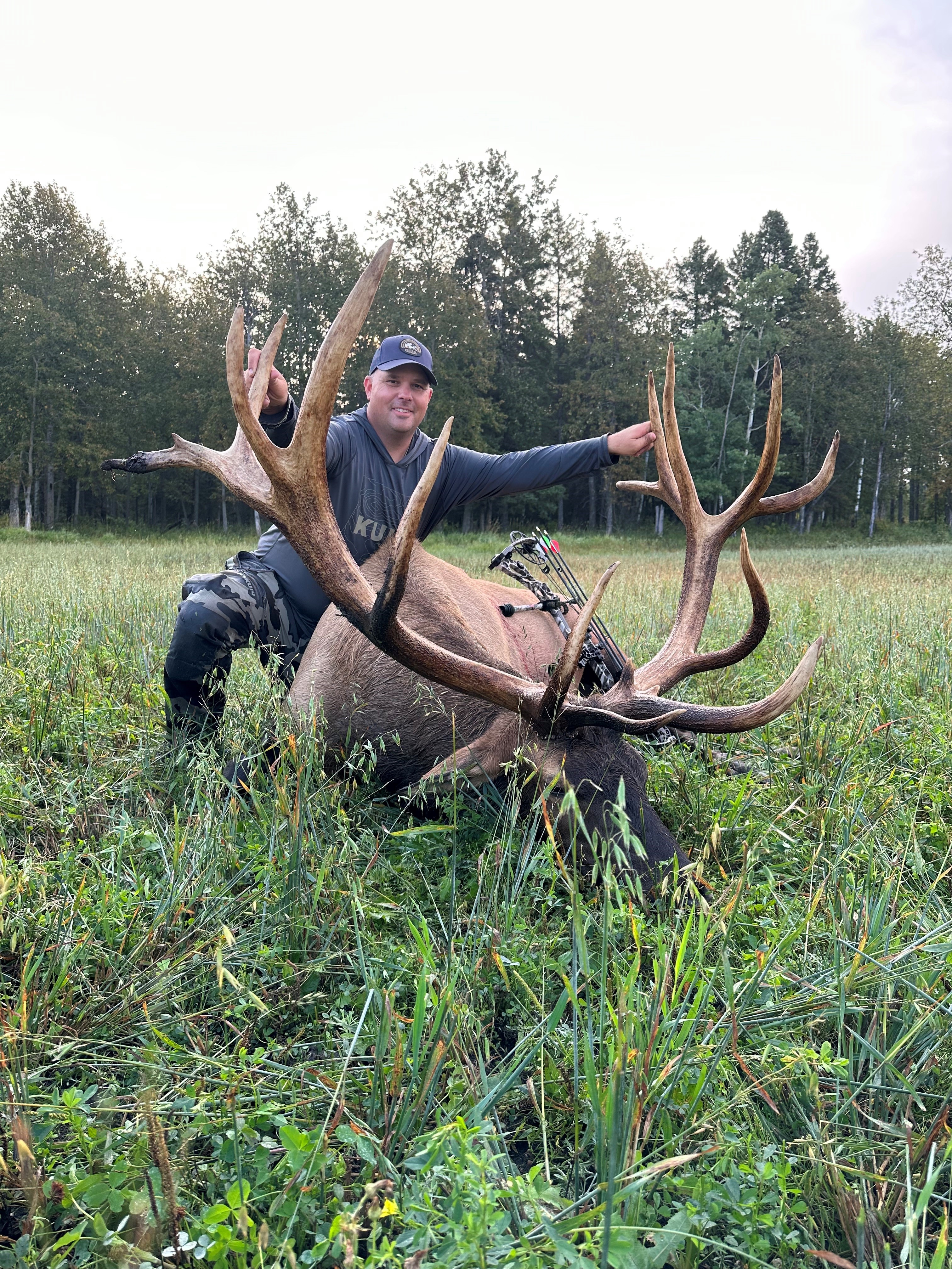 Issac Smith from North Dakota with trophy bull elk at Echo Lake Hunts in Saskatchewan