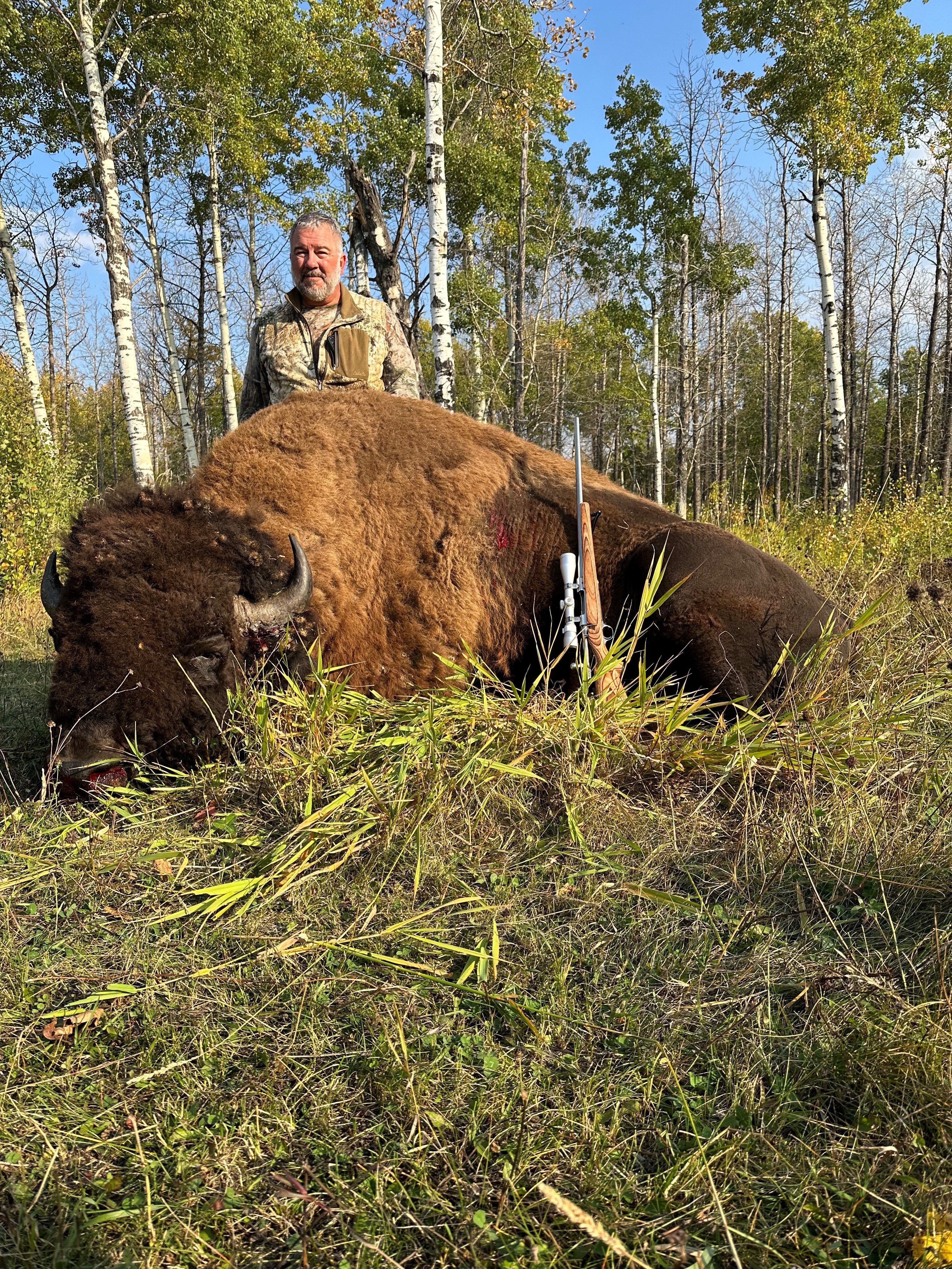 Zane Brink from South Dakota with trophy bison at Echo Lake Hunts in Saskatchewan