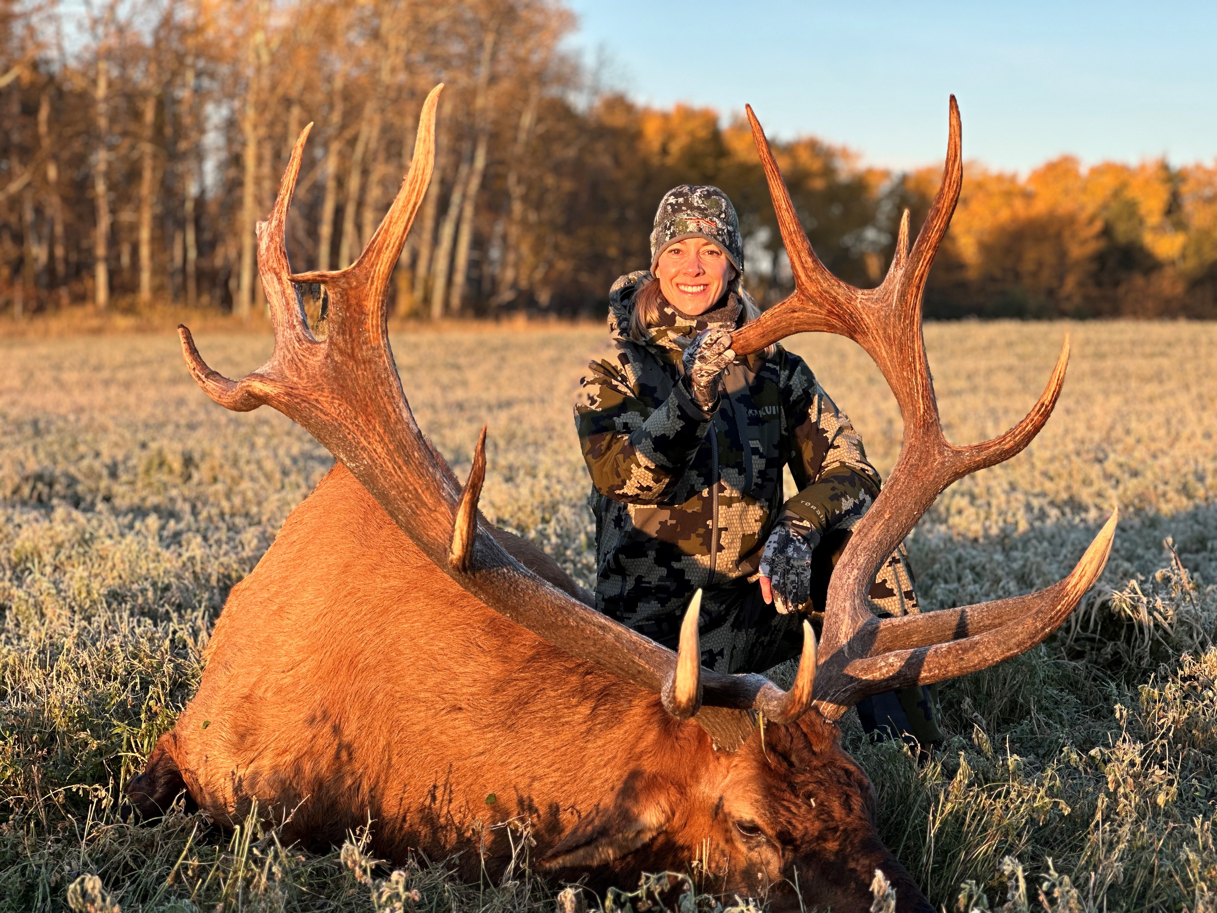 Georgia Grigor from Florida with trophy bull elk at Echo Lake Hunts in Saskatchewan