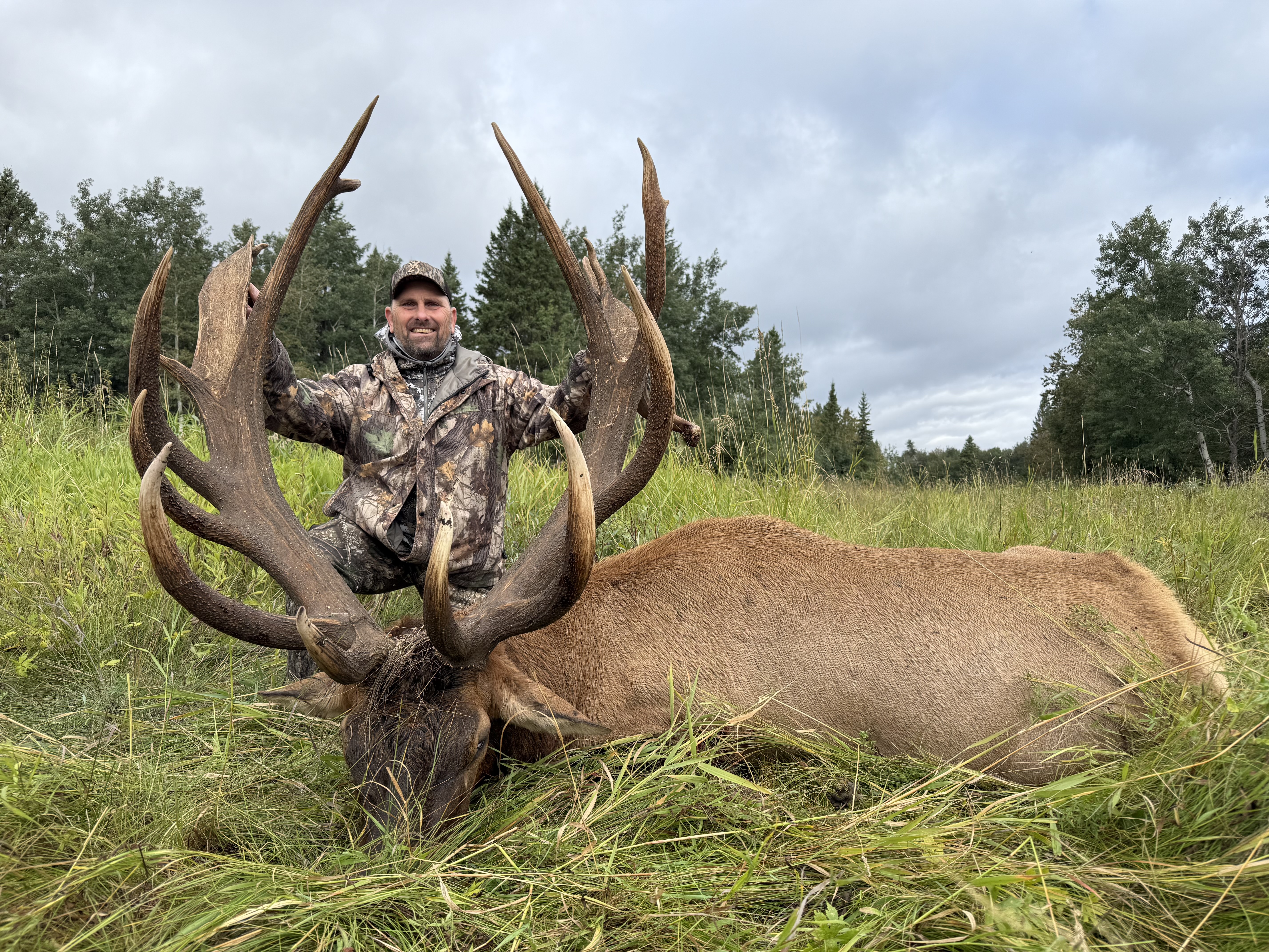 Bobby Jurisan from Michigan with a trophy bull elk at Echo Lake Hunts in Saskatchewan