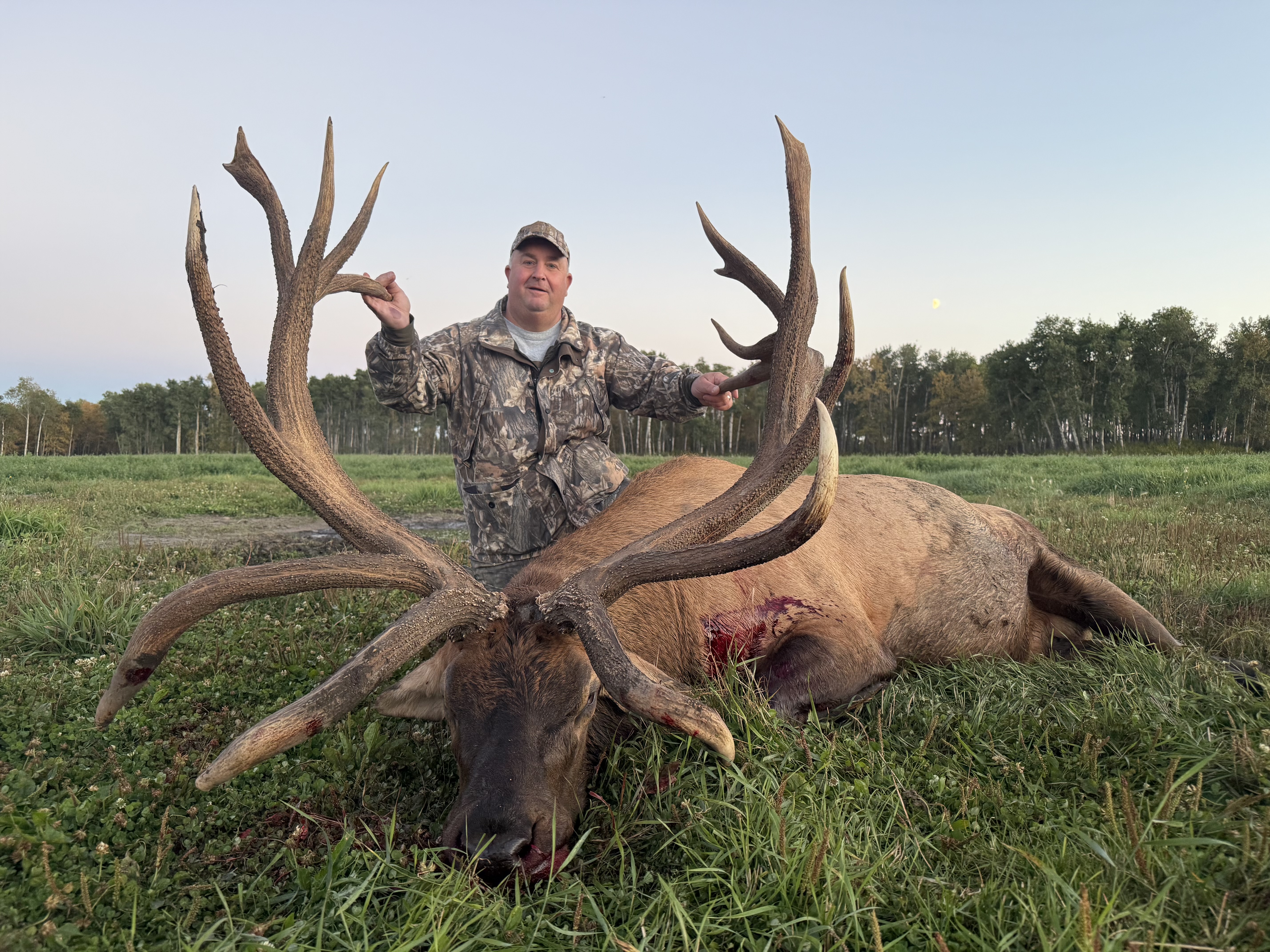 Jason Hamilton from Maine with a trophy bull elk at Echo Lake Hunts in Saskatchewan