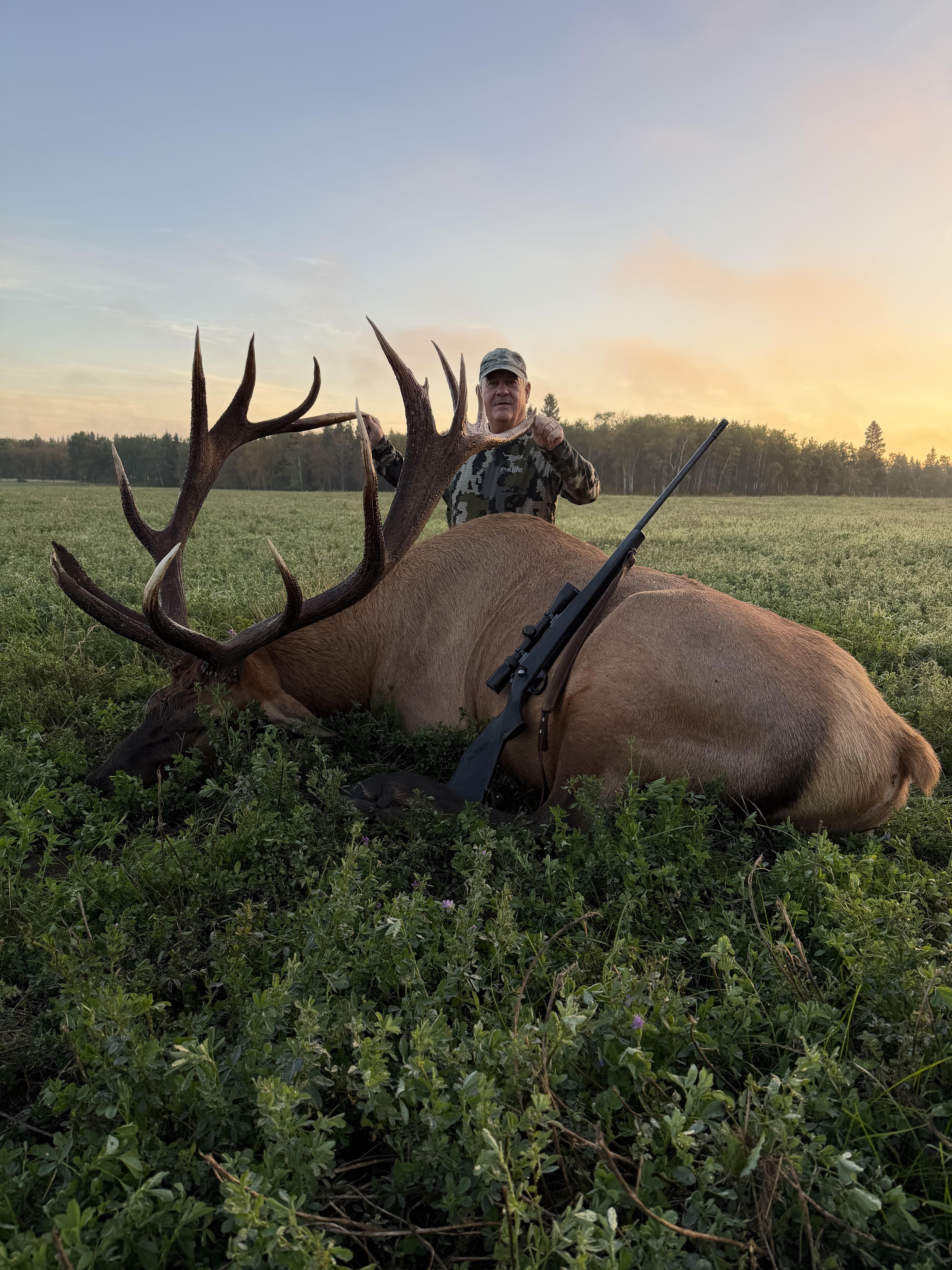 Joey Trice from Georgia with a trophy bull elk at Echo Lake Hunts in Saskatchewan